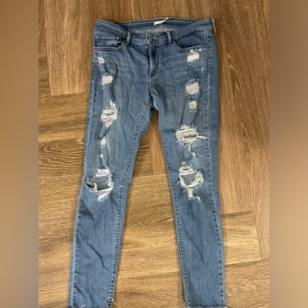 Mid rise Levi 711 ripped medium wash skinny jeans
